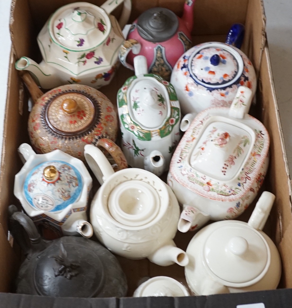 A quantity of various teapots including Doulton, Sadler etc.